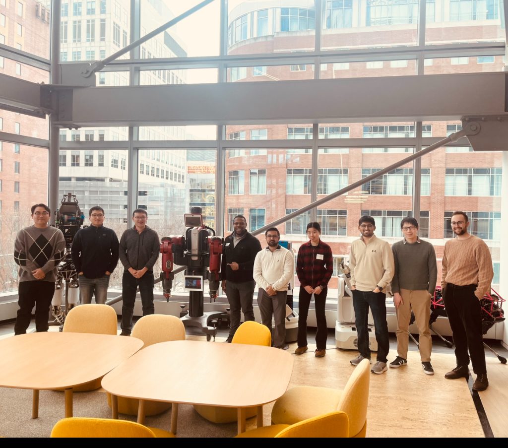Group photo of attendees in the Boston Dynamics office 