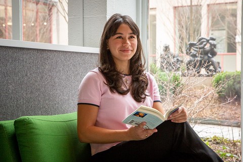 Picture of Grace reading a book at MIT