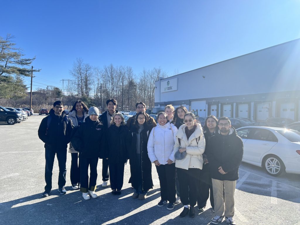 Group photo of students in front of the Symbotic office.