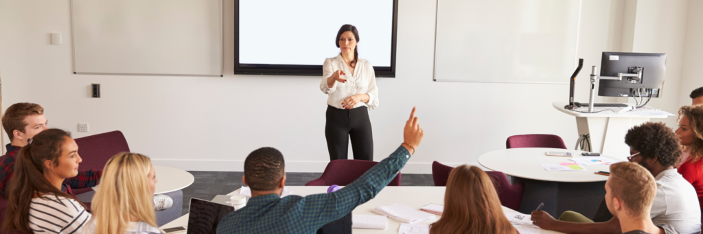 A professor speaks to her class.
