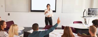 A professor speaks to her class.