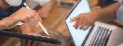 Person being shown something on tablet