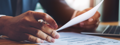 Hands holding a resume.