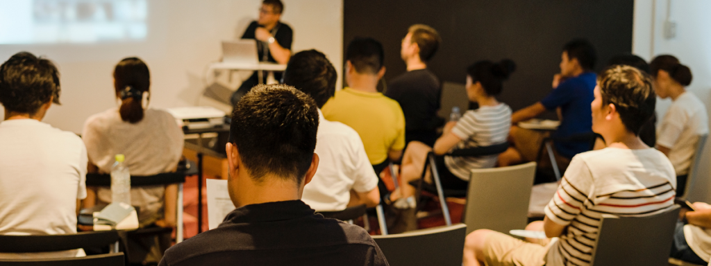 A group of people attend a workshop session.