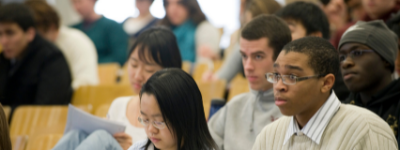 Students learning in class taking notes