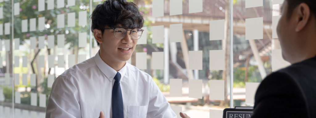 A student is smiling in an interview